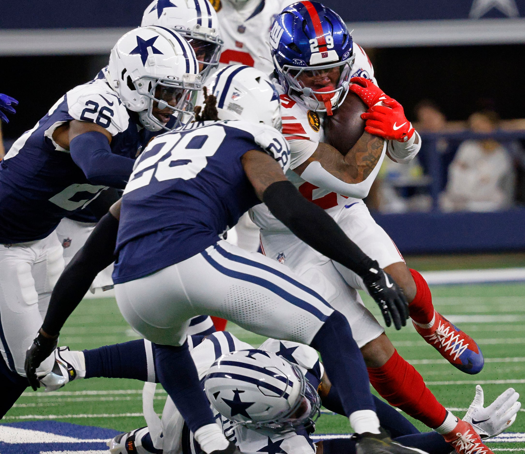 New York Giants running back Tyrone Tracy Jr. (29) is tackled by Dallas Cowboys cornerback...