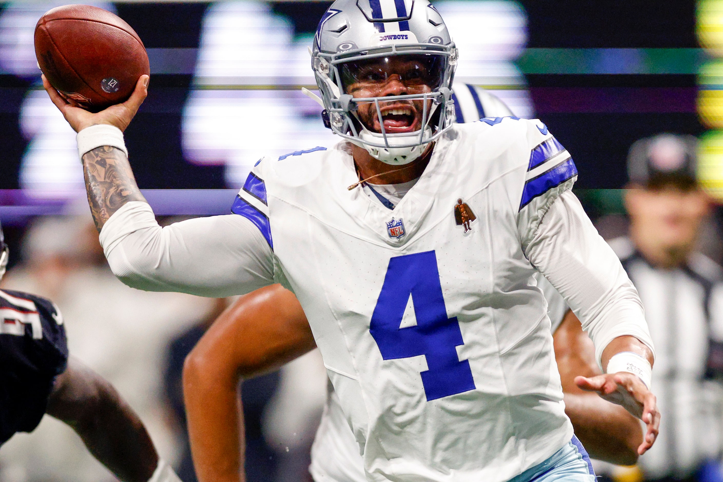 Dallas Cowboys quarterback Dak Prescott (4) throws a touchdown pass to running back Rico...