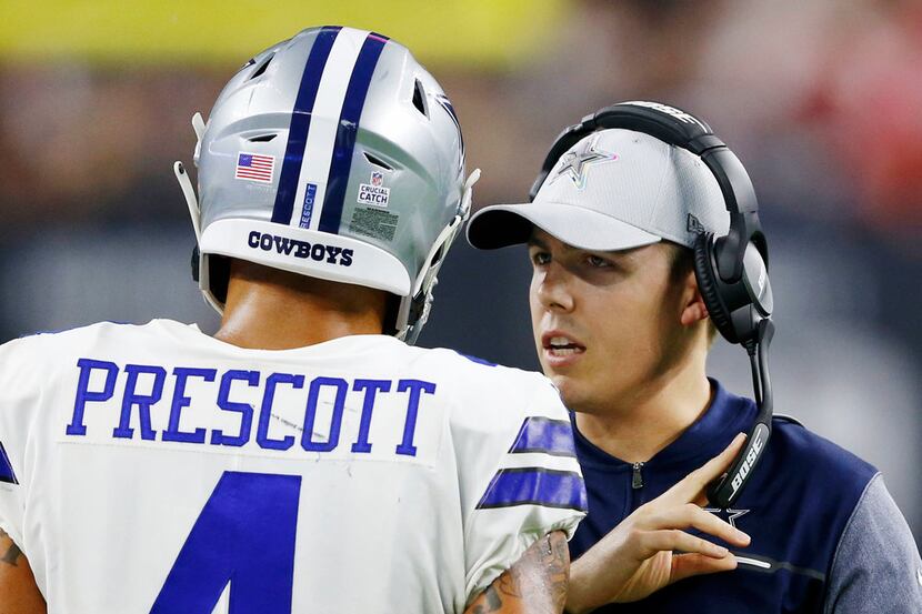 FILE - Cowboys assistant Kellen Moore talks to quarterback Dak Prescott (4)  during the...