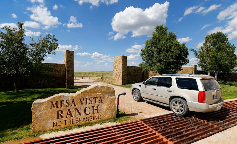 Businessman T. Boone Pickens enters a gate on his Mesa Vista Ranch in the panhandle of Texas...