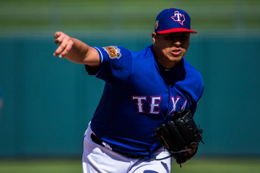 Texas Rangers starting pitcher Ariel Jurado (74) pitches during the fifth inning of a spring...