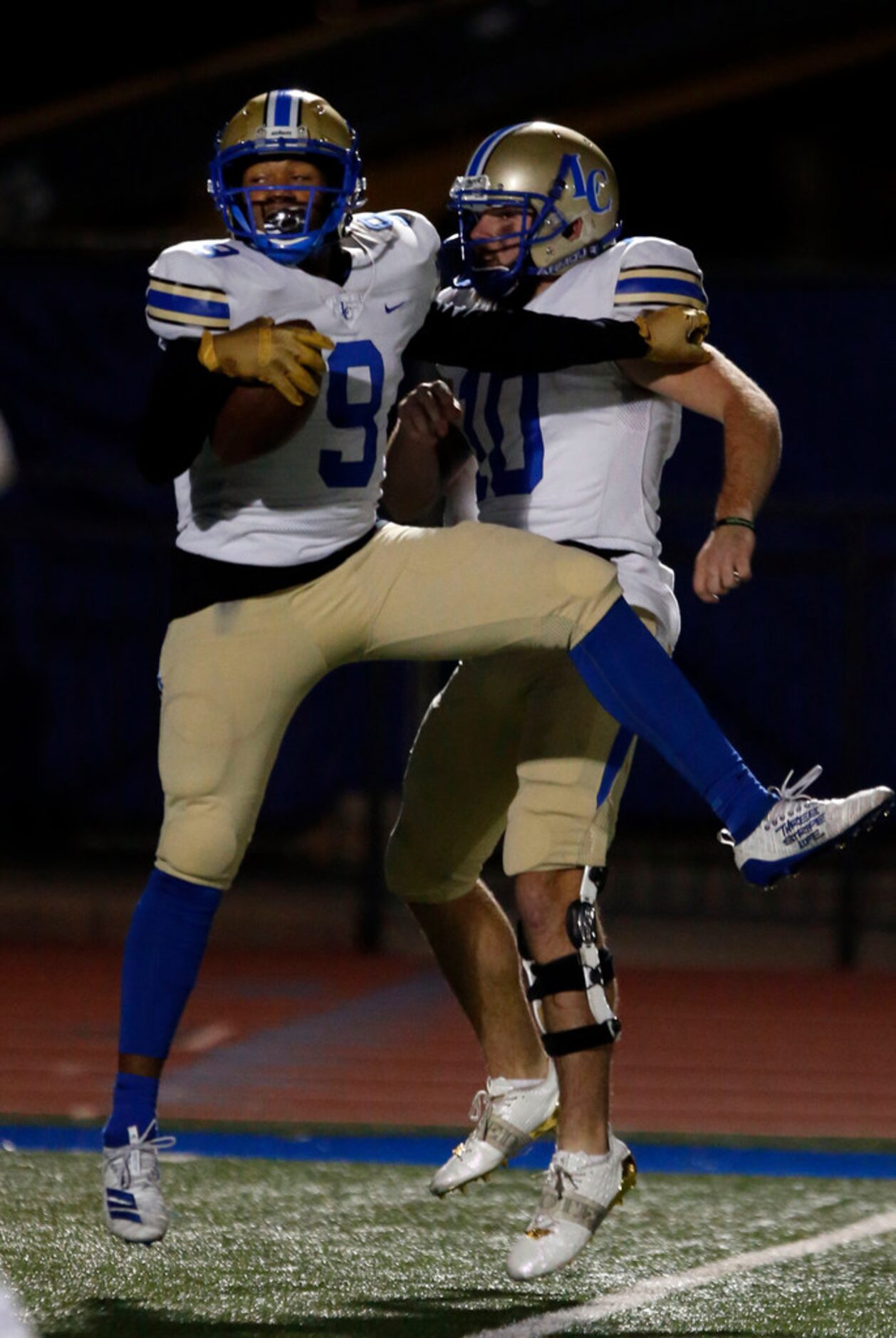 Lakeview's Jalen Davis (9) and arrest Adams (10) celebrate after Davis' touchdown during the...