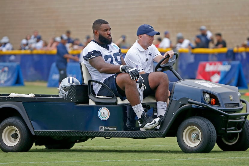 Cowboys guard/tackle Chaz Green is carted off during an afternoon practice at training camp...