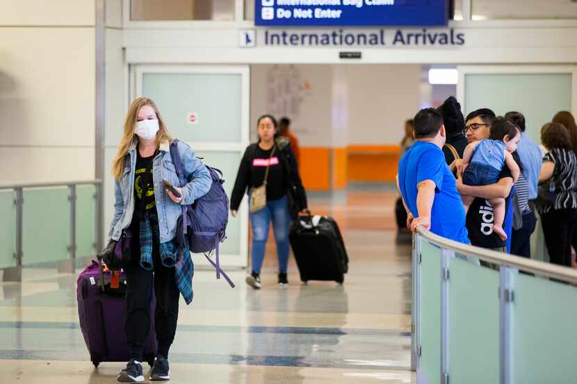 International travelers arrived at Terminal D at DFW International Airport on March 12,...