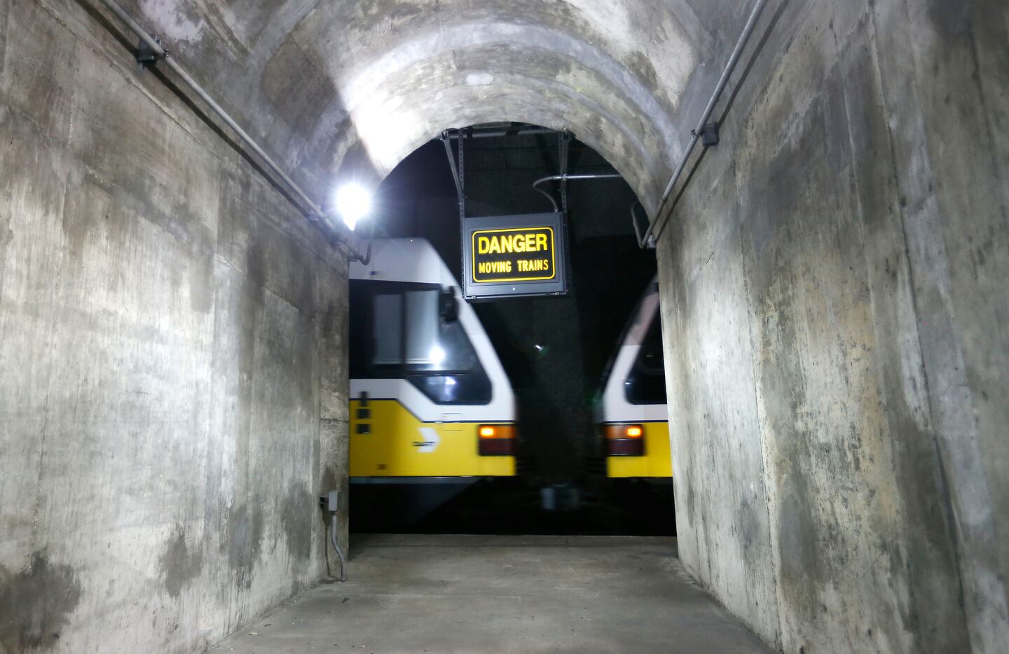 A DART train whizzes past a maintenance tunnel near the unfinished Knox Street station 80...