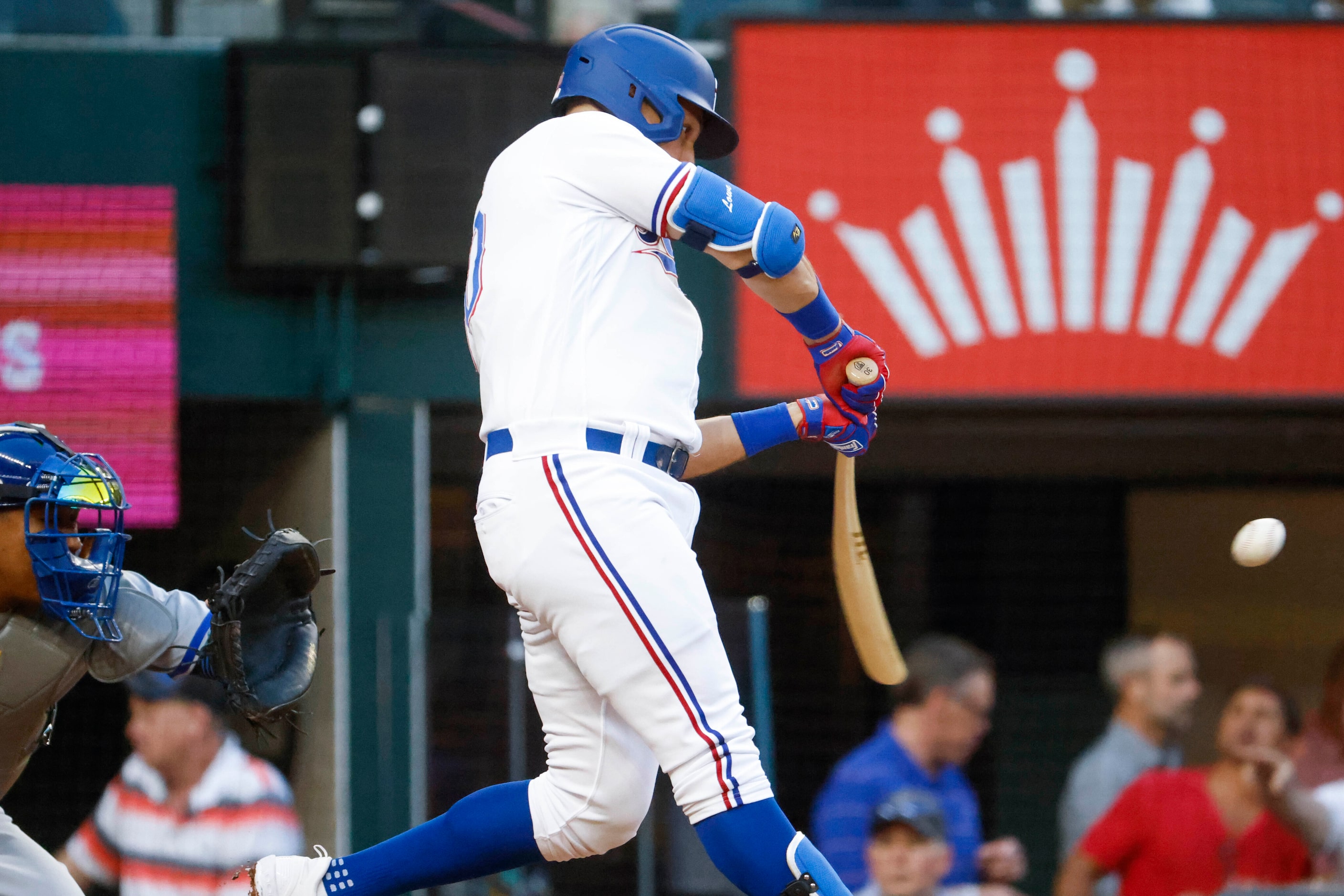 Texas Rangers first baseman Nathaniel Lowe hits a home run on a fly ball during the first...