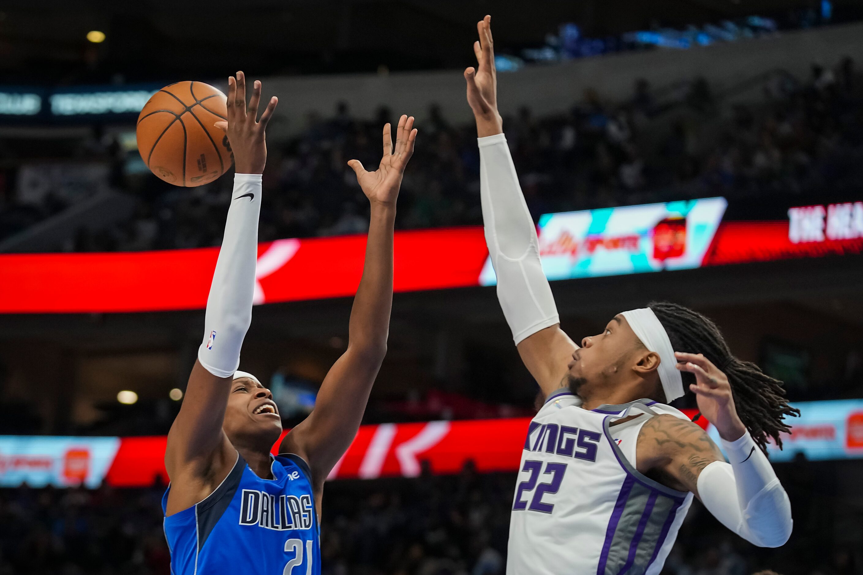 Dallas Mavericks guard Frank Ntilikina (21) is fouled by Sacramento Kings center Richaun...