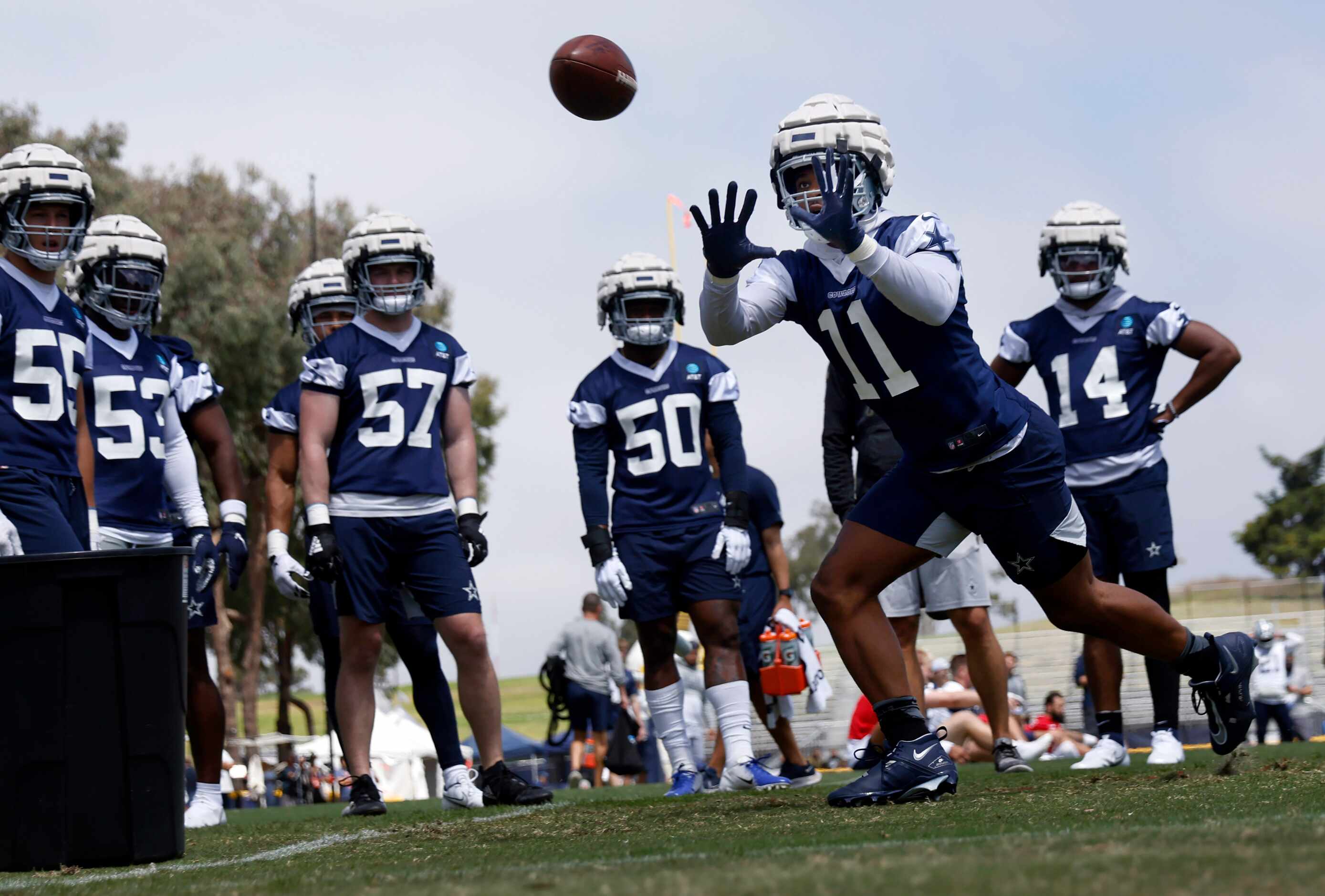 Dallas Cowboys outside linebacker Micah Parsons (11) catches a pass during defensive drills...