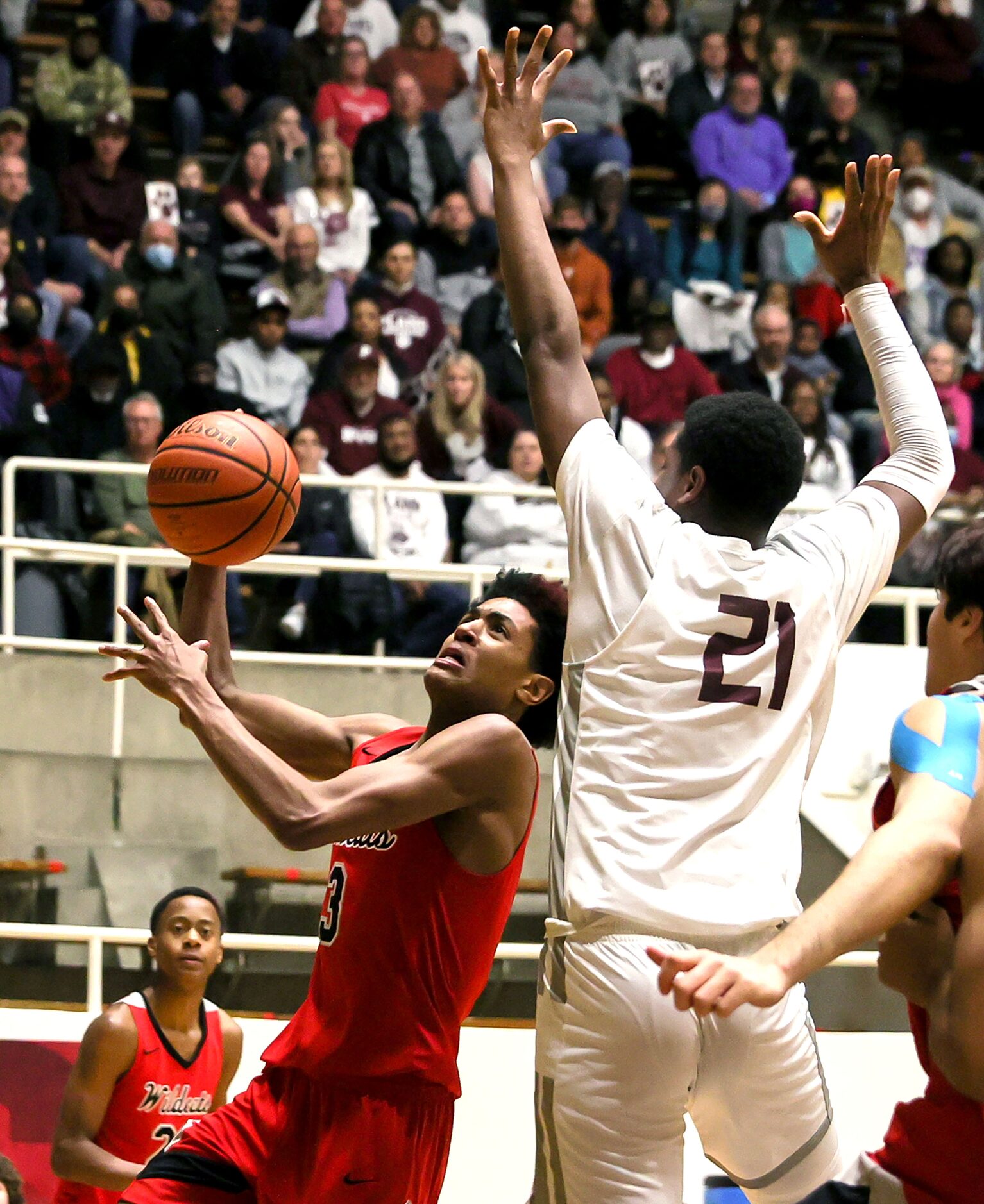 Lake Highland guard BJ Davis (3) tries to put up a shot over Plano forward Justin McBride...