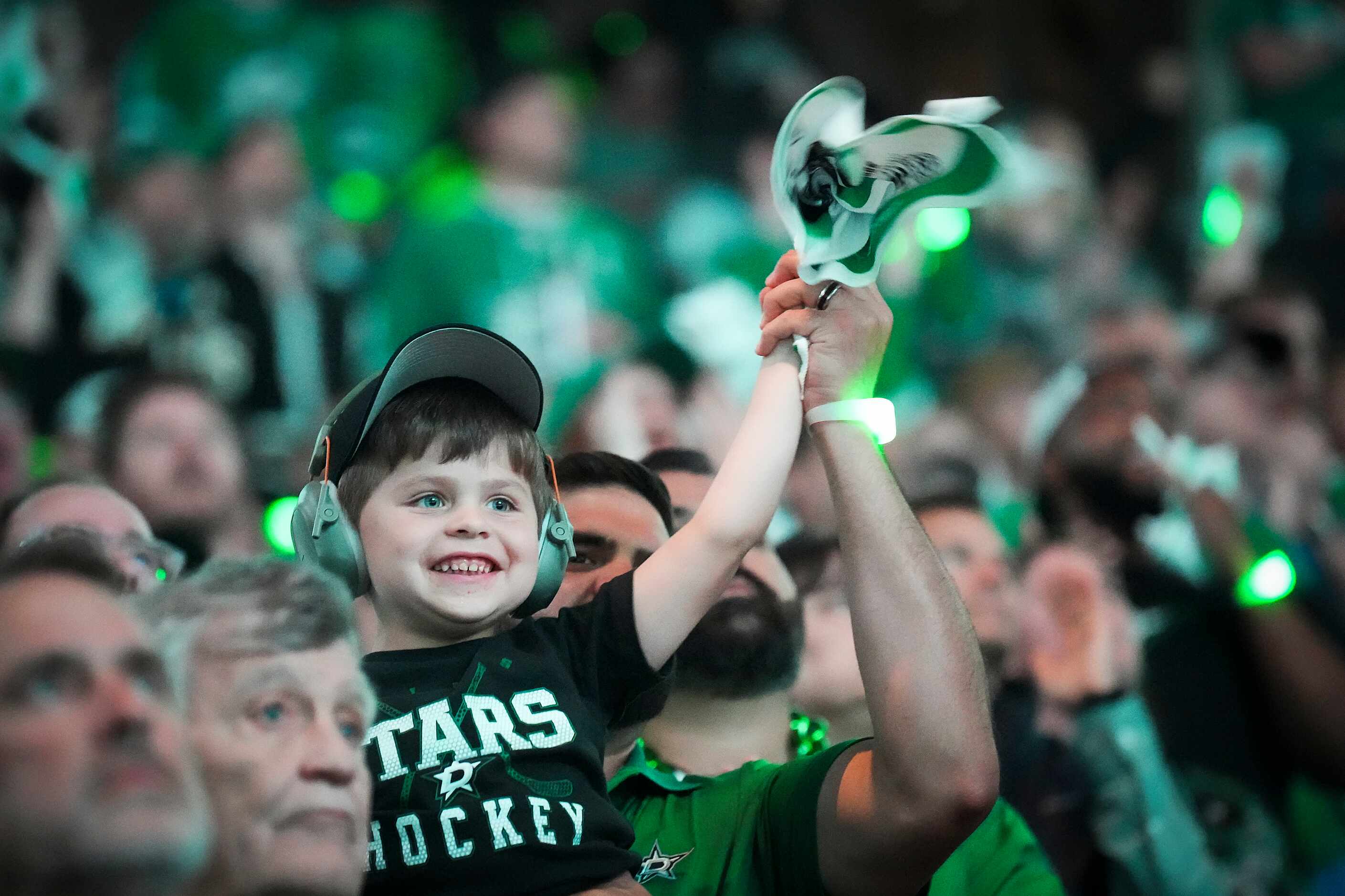 Dallas Stars fans cheer as their team takes the ice for the first period in Game 5 of an NHL...