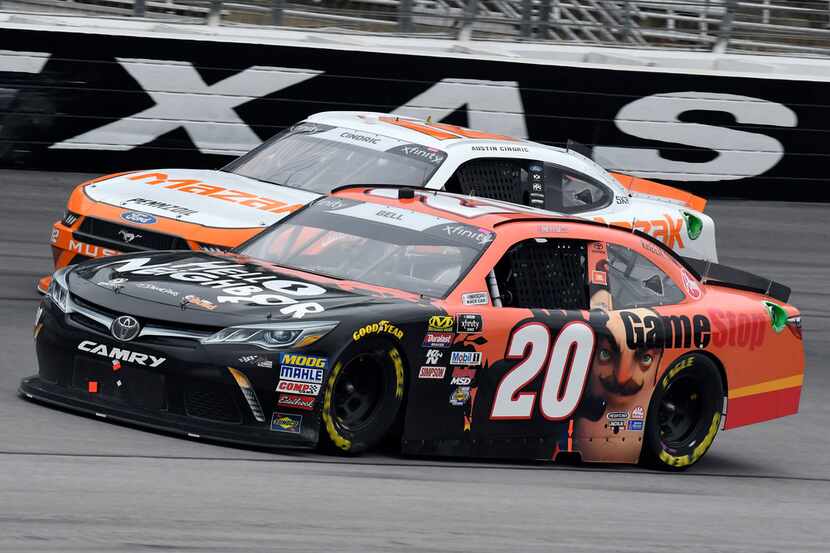Christopher Bell (20) leads Austin Cindric, rear, out of Turn 4 late in the NASCAR XFinity...