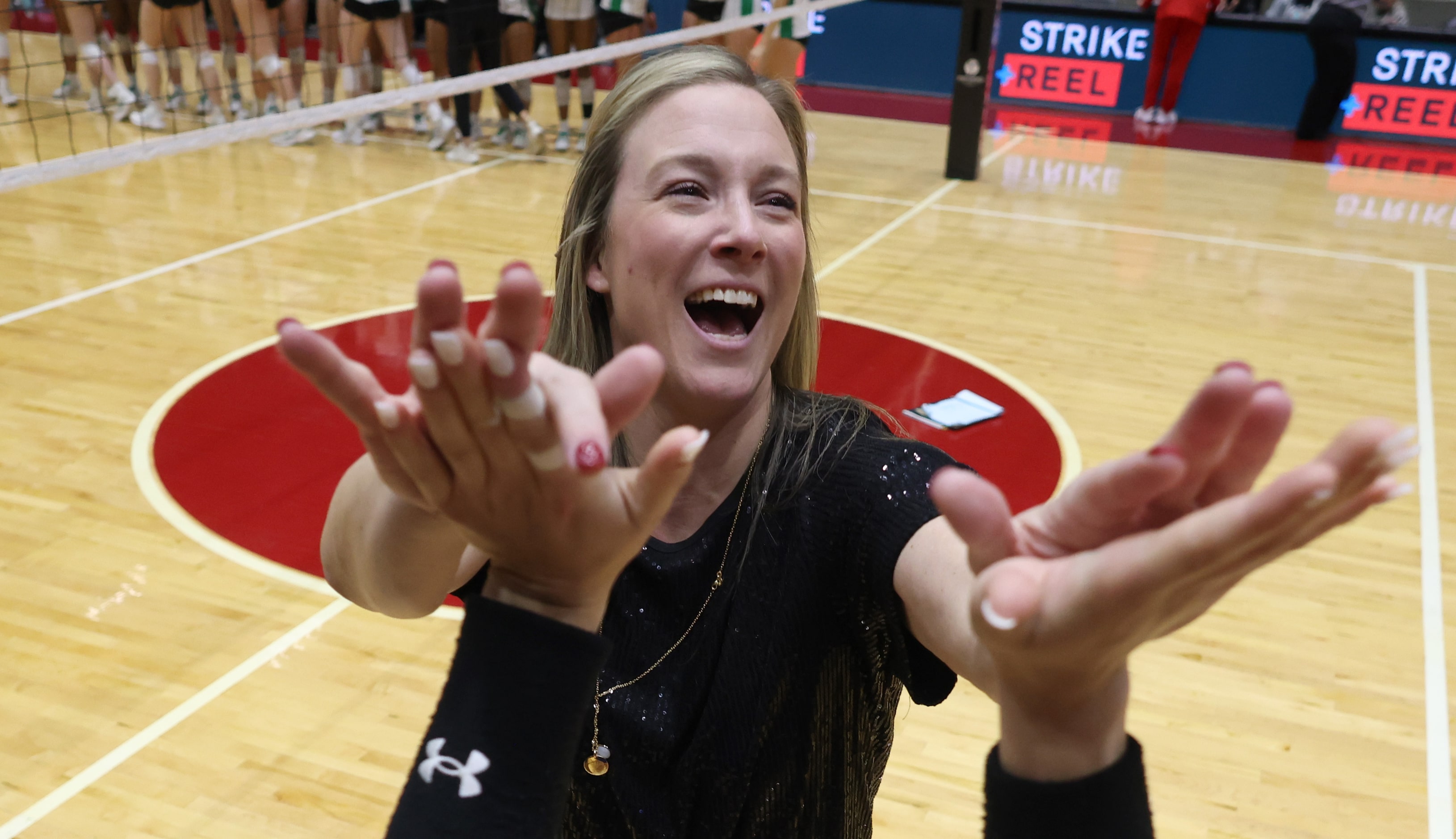 Byron Nelson head volleyball coach Brianne Groth was all smiles as she celebrated with her...