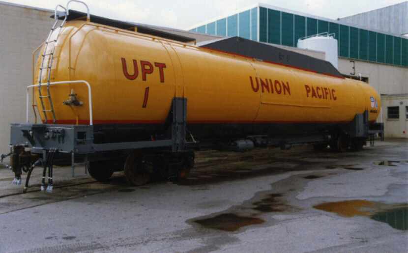 A natural gas tender car provides fuel for an experimental natural gas locomotive.