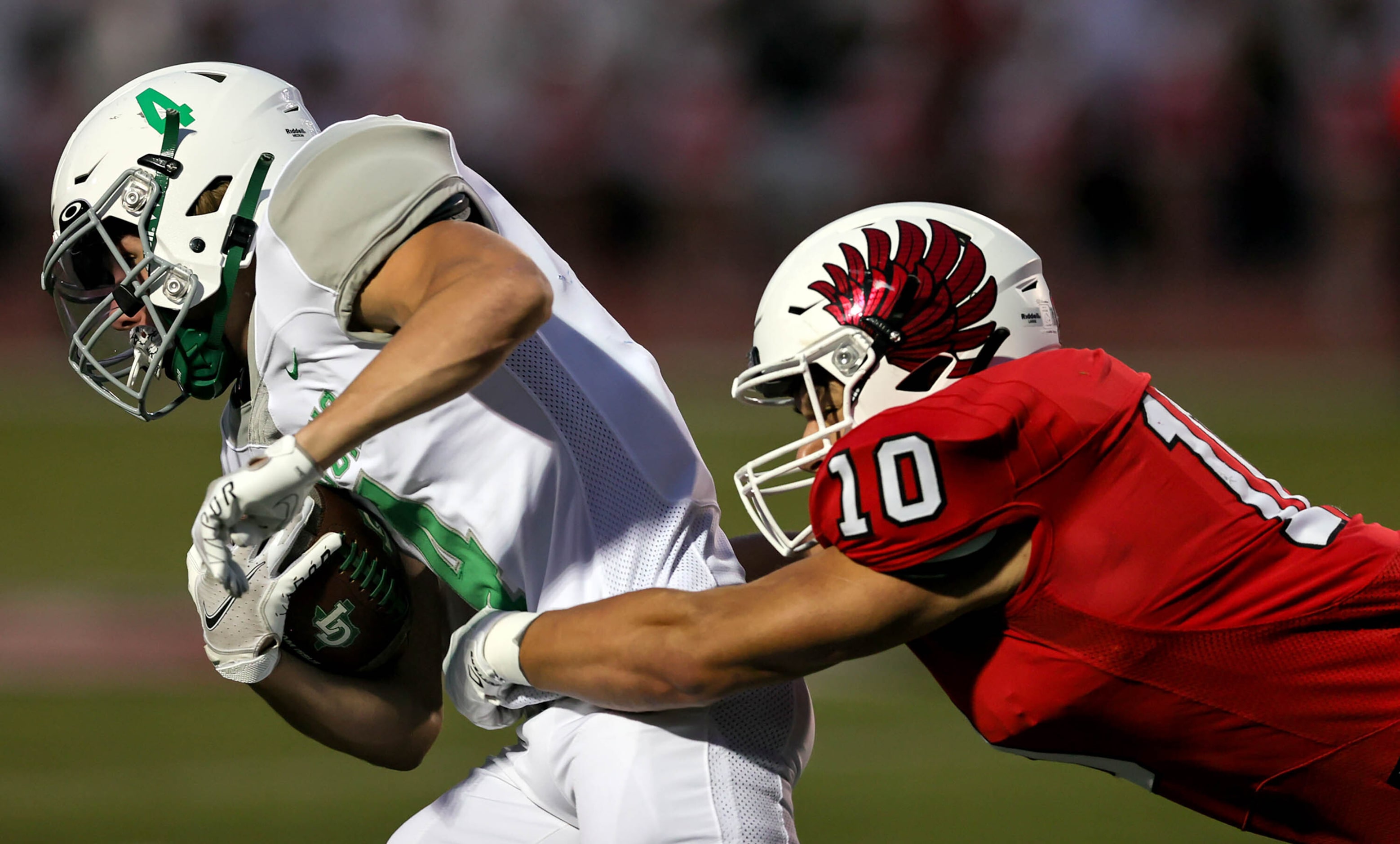 Lake Dallas running back Dylan Brauchle (4) gets wrapped up by Argyle linebacker Grant...