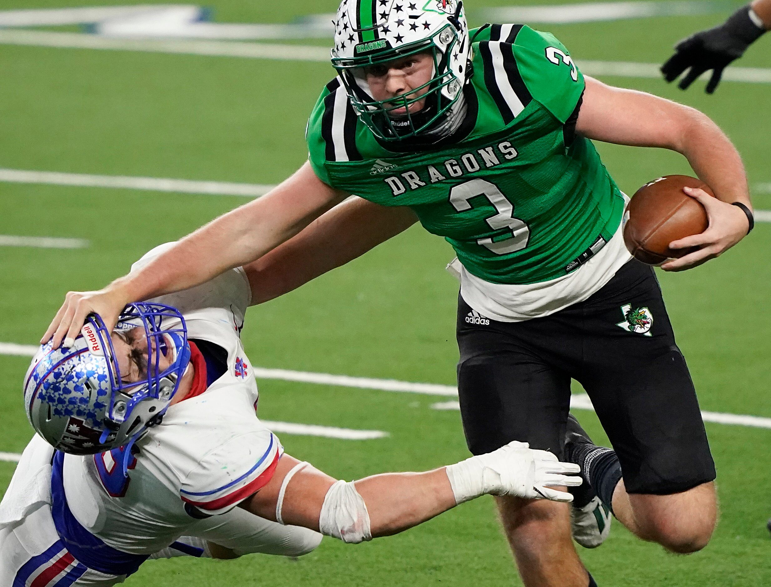 Southlake Carroll quarterback Quinn Ewers (3) pushes past Austin Westlake linebacker...