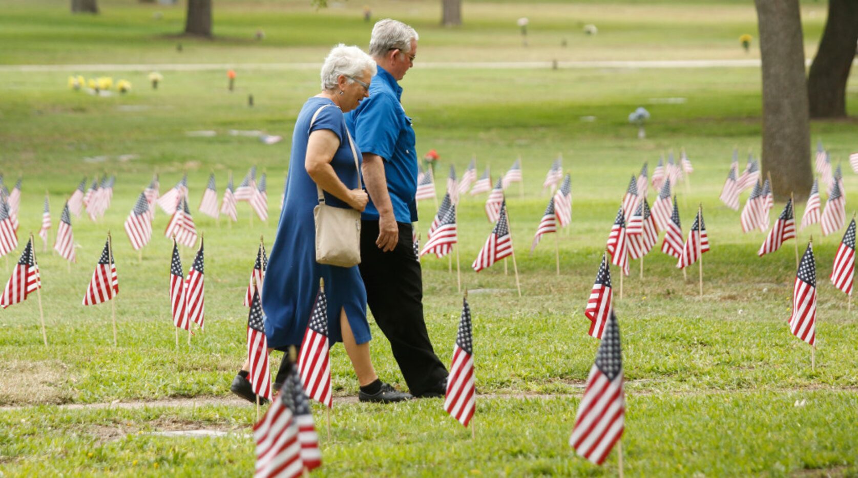 Jane and Charles Skinner walk back to their car after Saturday's ceremony at Restland...