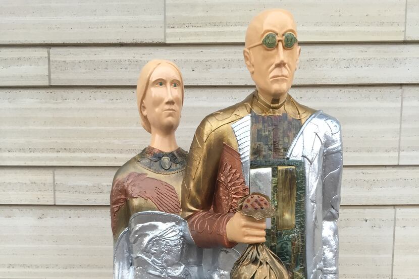 One of the "Overalls all over" statues with artists' interpretations of the couple in...