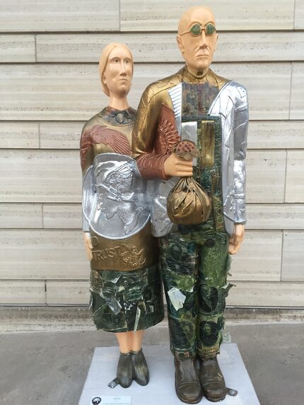 One of the "Overalls all over" statues with artists' interpretations of the couple in...