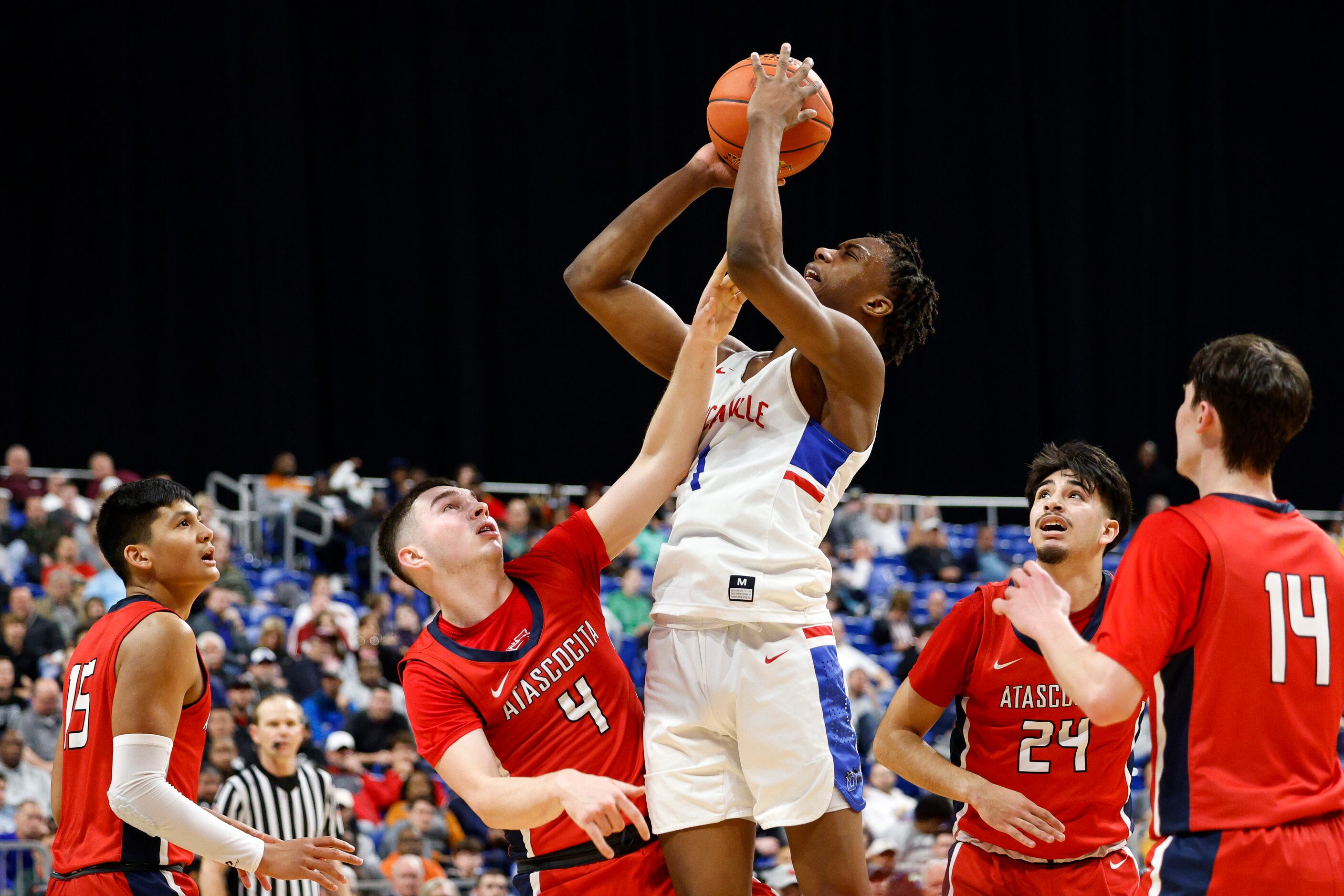 Duncanville forward Ron Holland (1) shoots the ball over Humble Atascocita guard AJ Aungst...