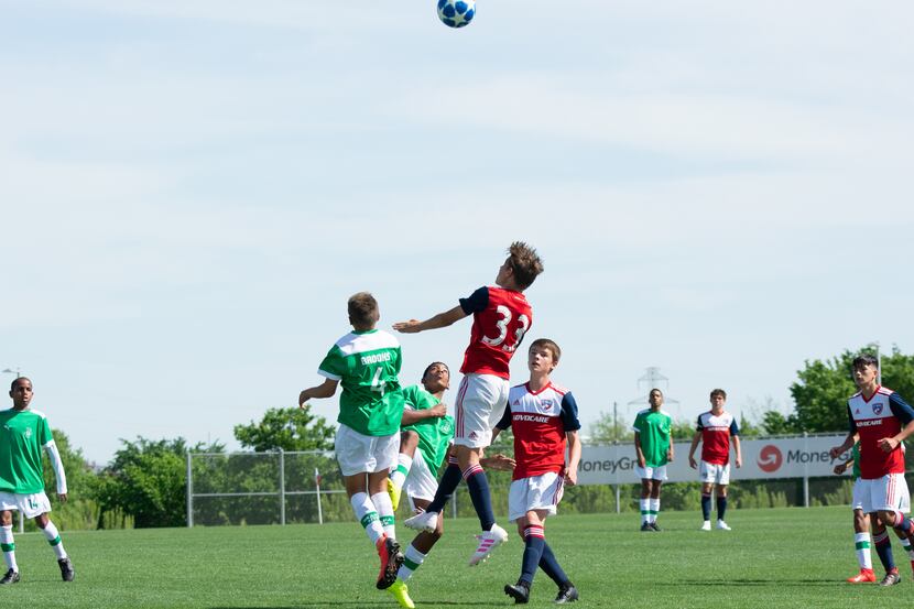 #33 Nighte Pickering goes up for a header against Ikapa United in the 2019 Dallas Cup Super...