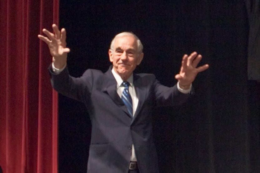 Ron Paul waved to supporters Friday at a pre-caucus rally in Wichita, Kan. The Lake Jackson...