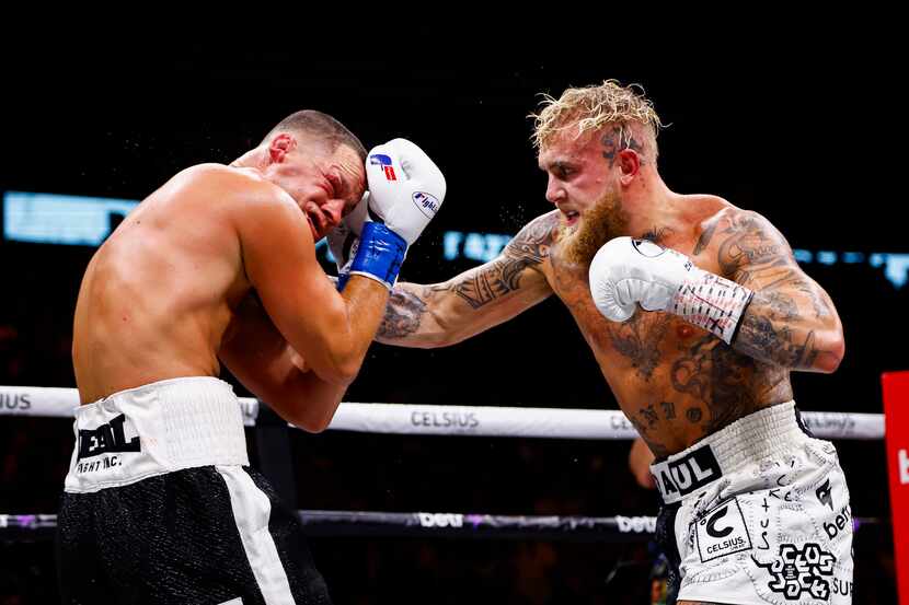 Jake Paul, right, lands a punch on Nate Diaz during a boxing match in Dallas, Saturday,...