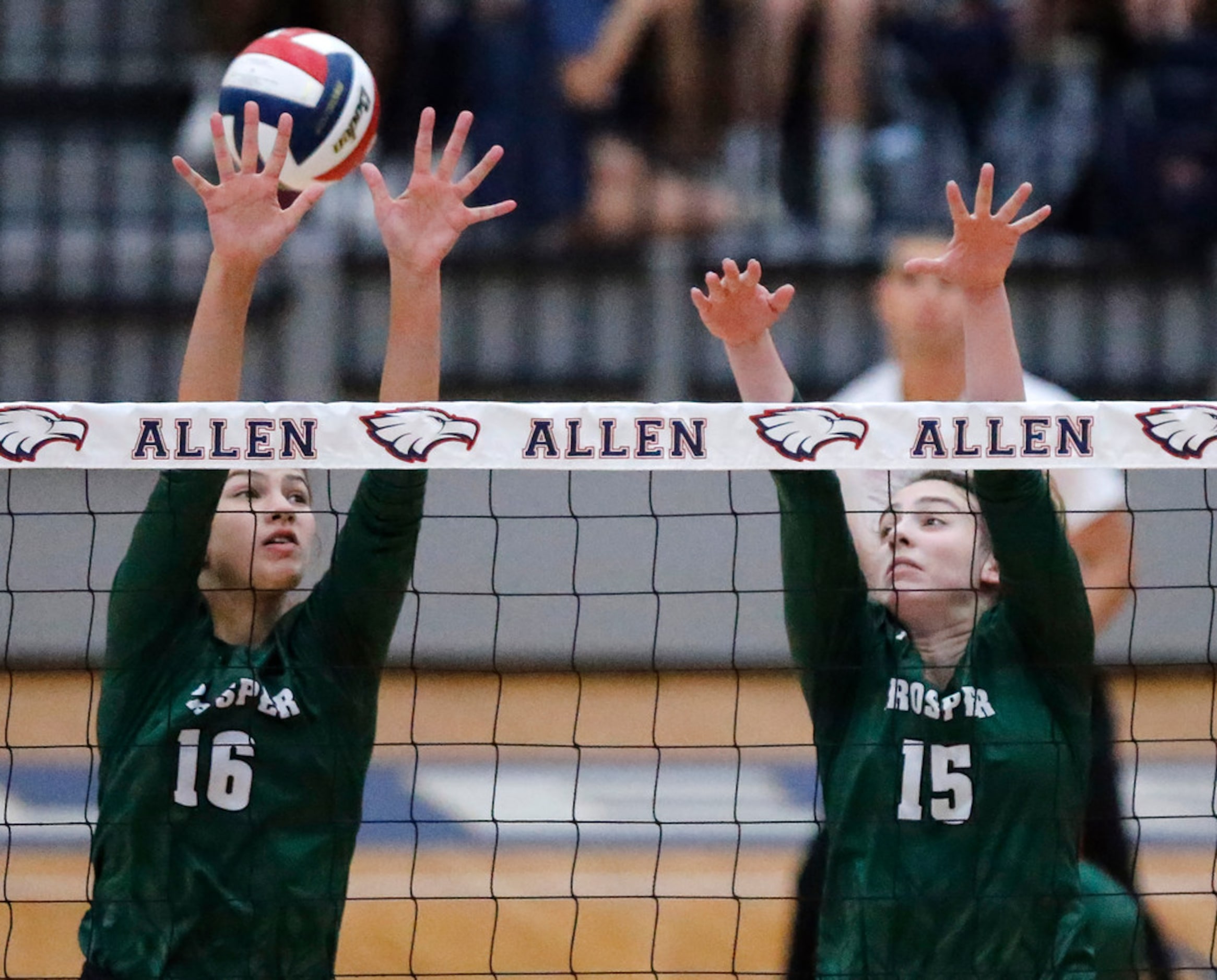 Prosper High School middle blocker Taylor Youtsey (16) and Prosper High School outside...