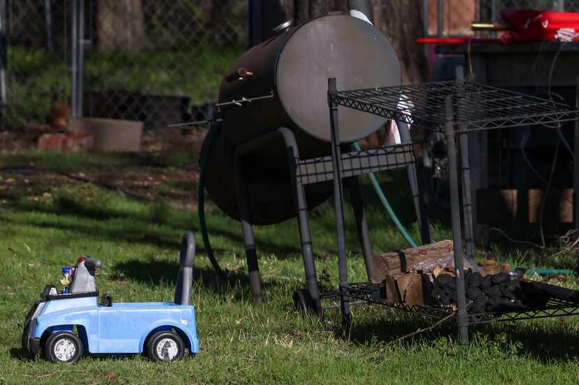 A toy car sits on Saturday, March 4, 2023, along the side of the home where three children...