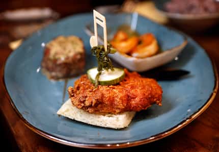 Nashville Hot Chicken is served on white bread with pickles at Reba’s Place in Atoka, Okla....