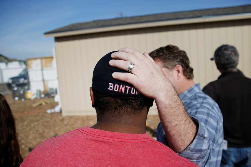 Daron Babcock, at right, embracing Clifton Reese at Bonton Farms in 2015. These men have...
