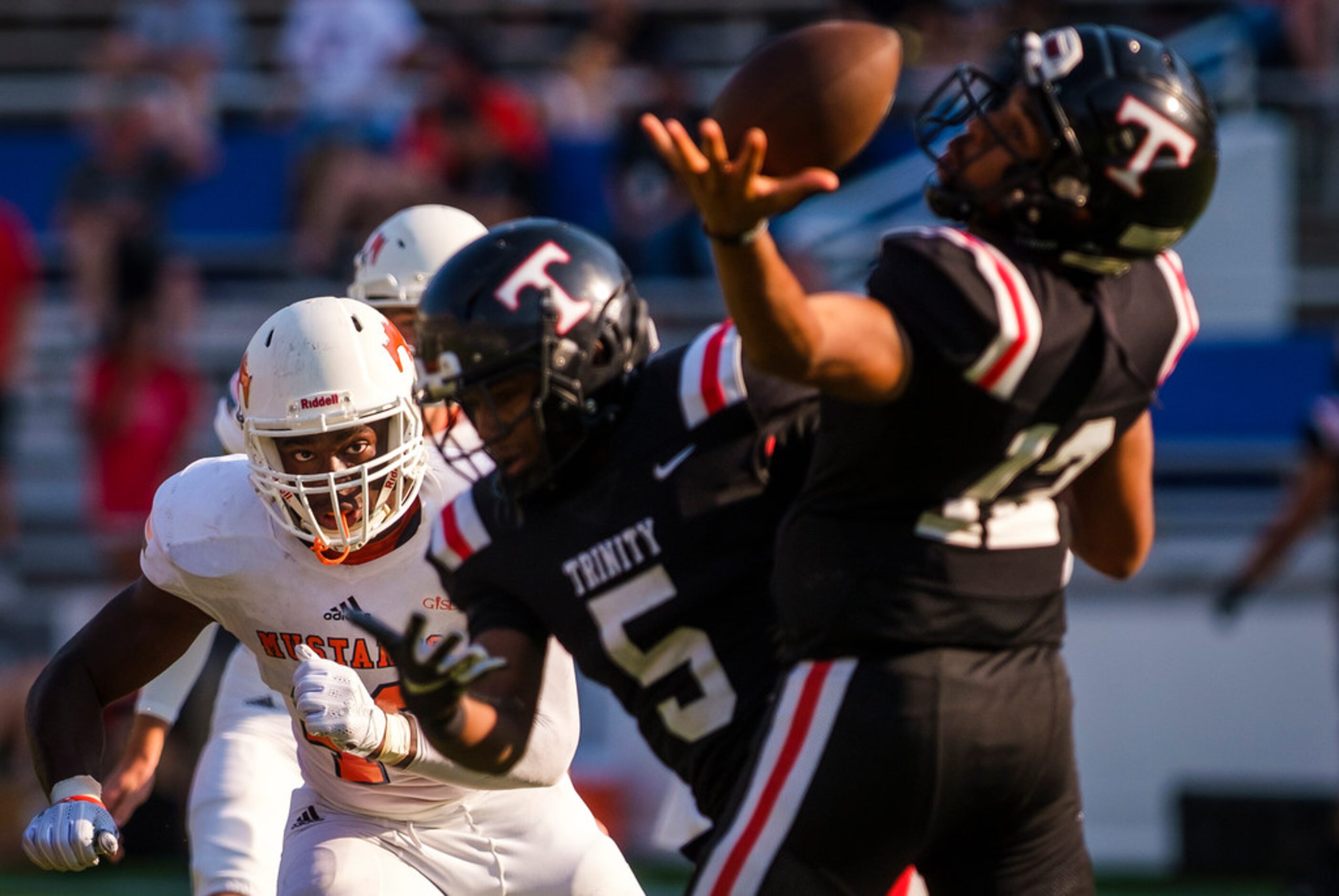 Sachse defensive lineman Anthony Anyanwu (46) bears down on  Euless Trinity quarterback...