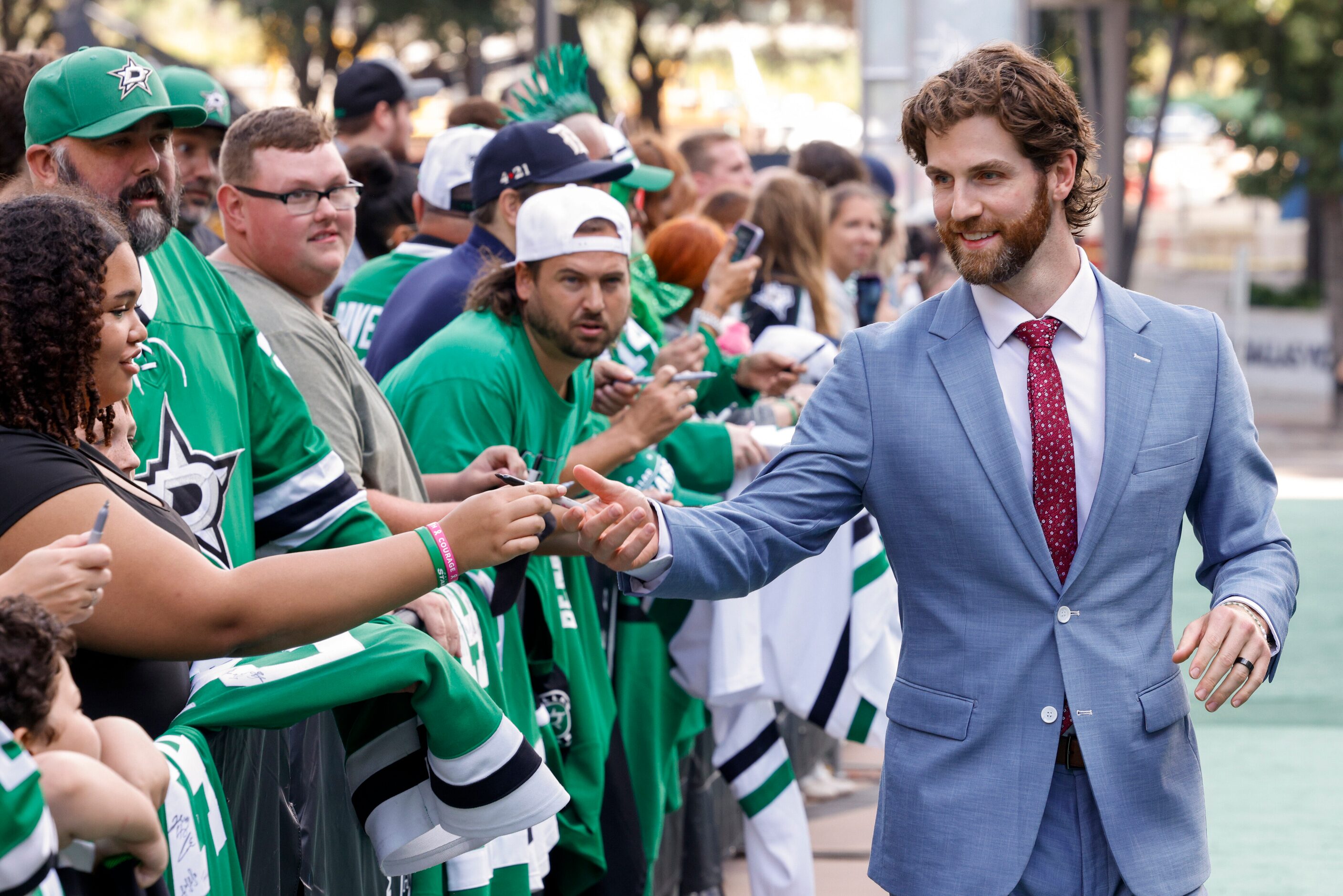 Dallas Stars goaltender Scott Wedgewood greets fans on the green carpet to the American...