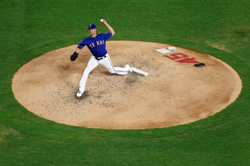 Texas Rangers Mike Minor (23) pitches during the fifth inning of play against the Los...