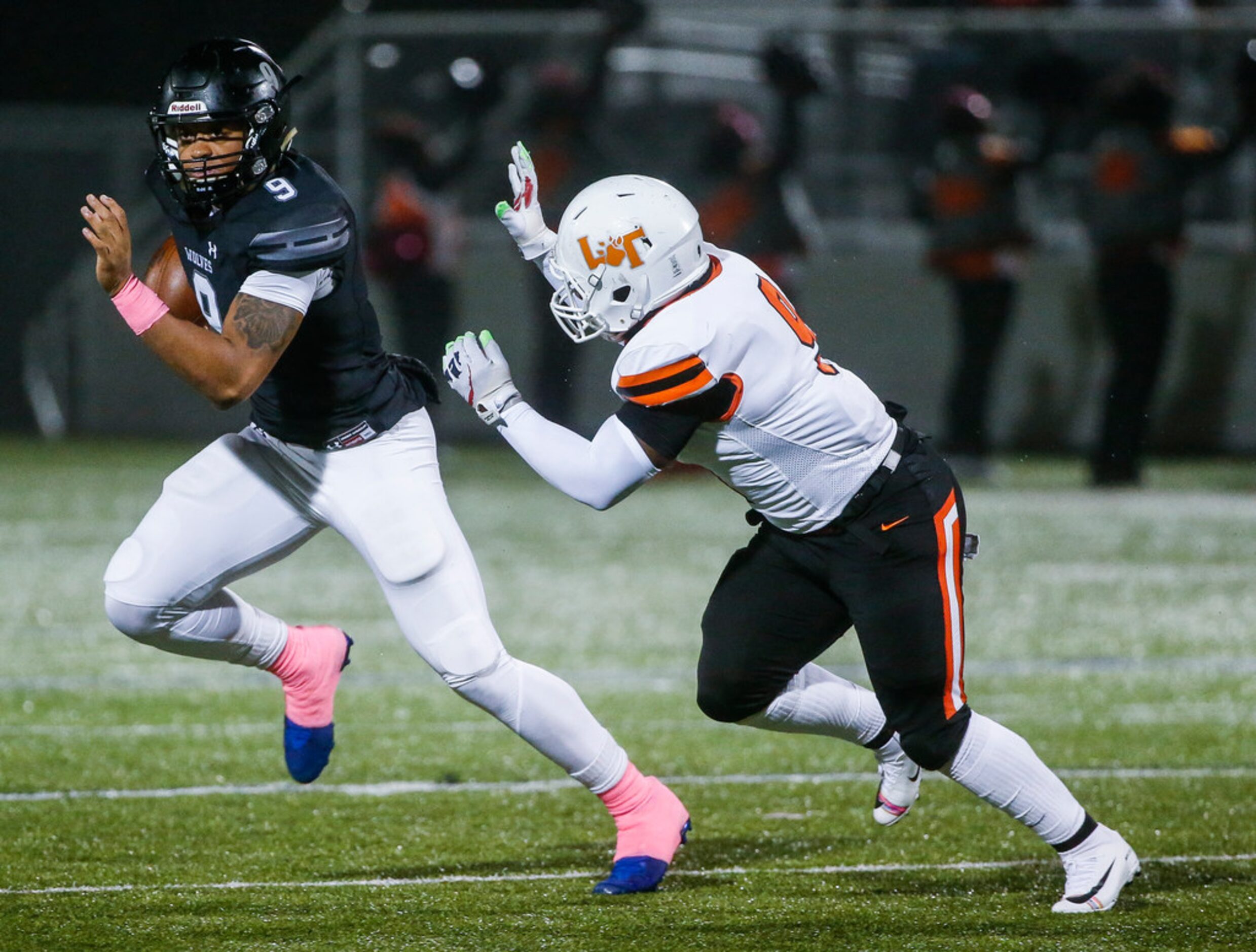 Mansfield Timberview's Jaden Hullaby (9), left, makes a break away from Lancaster's Jaylen...