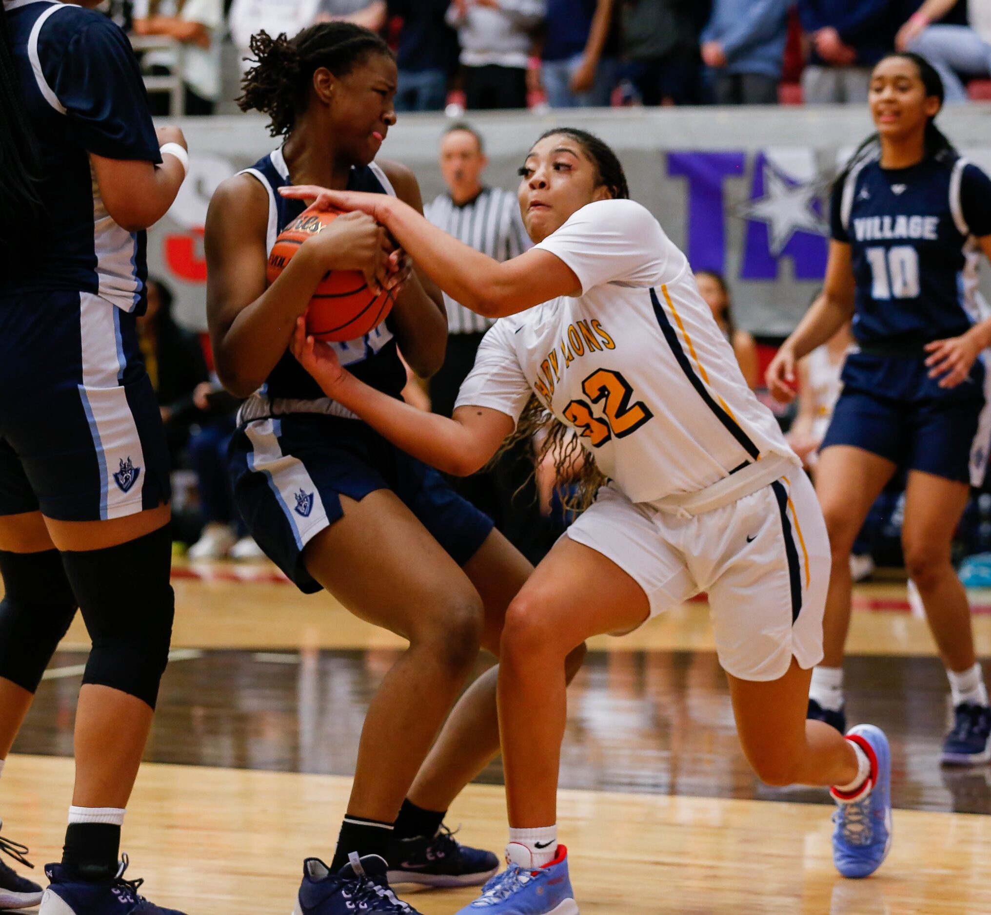 Plano Prestonwood Christian's Jordan Webster (32) fights the Village School's RyLee Grays...