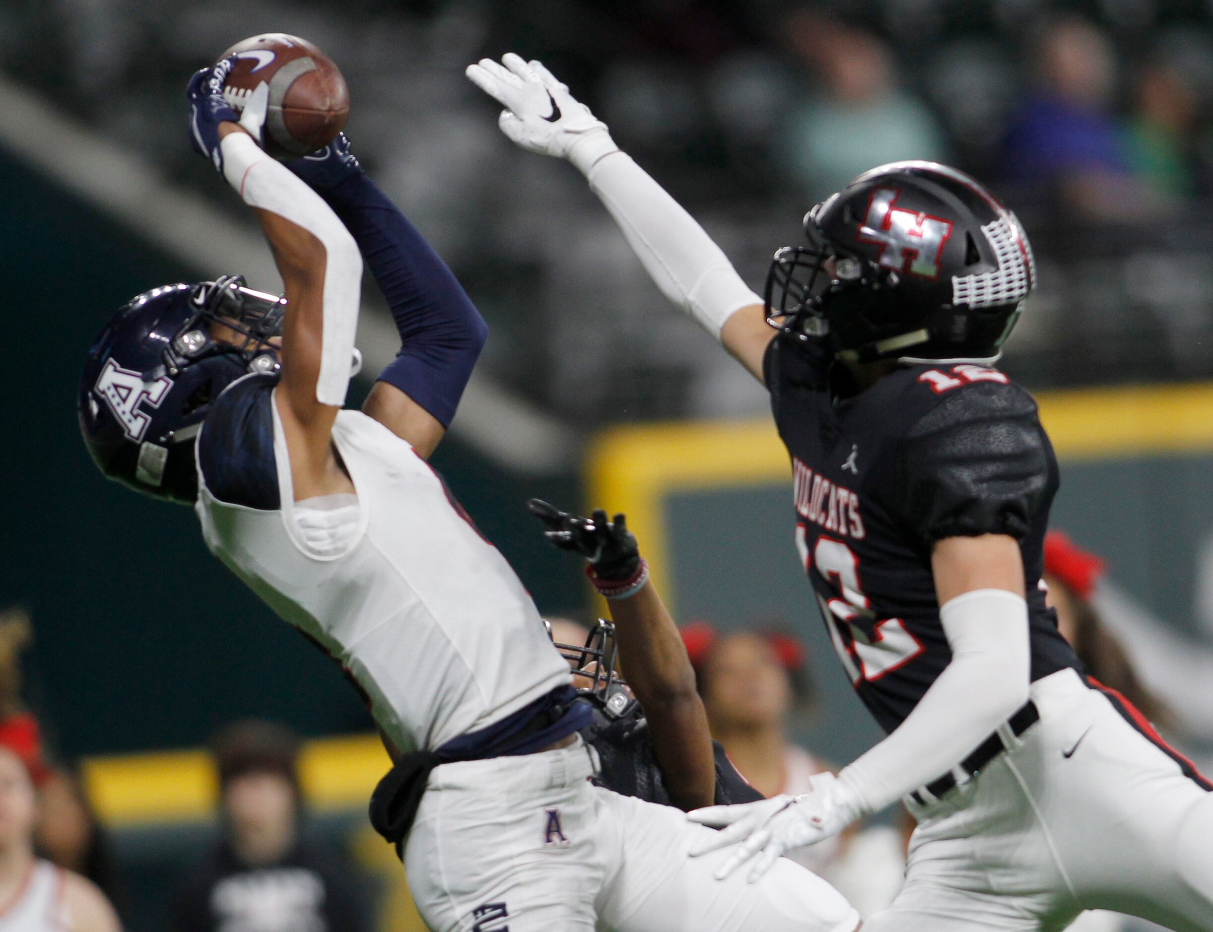 Allen receiver Jordan Tyson (4) leaps to pull in a pass but was broken up by Lake Highlands...