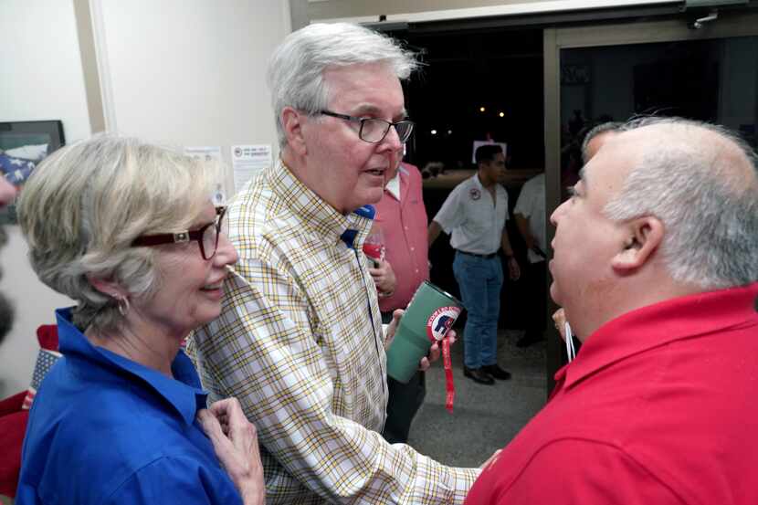 Texas Lt. Gov. Dan Patrick speaks with supporters before leaving as he campaigns at the...