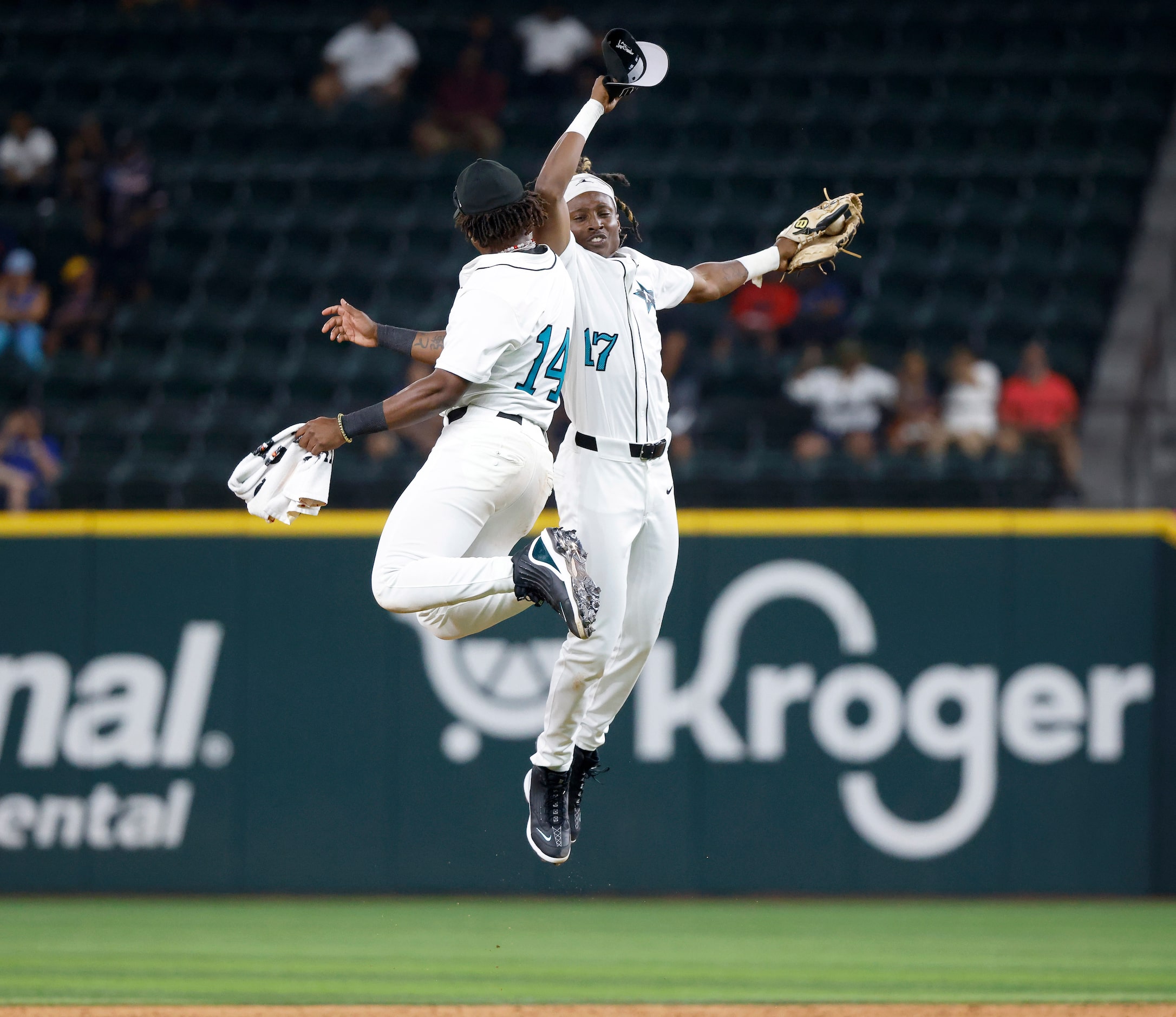 American League players Kyle Walker (14) and  KJ White Jr. (17) celebrate their HBCU...