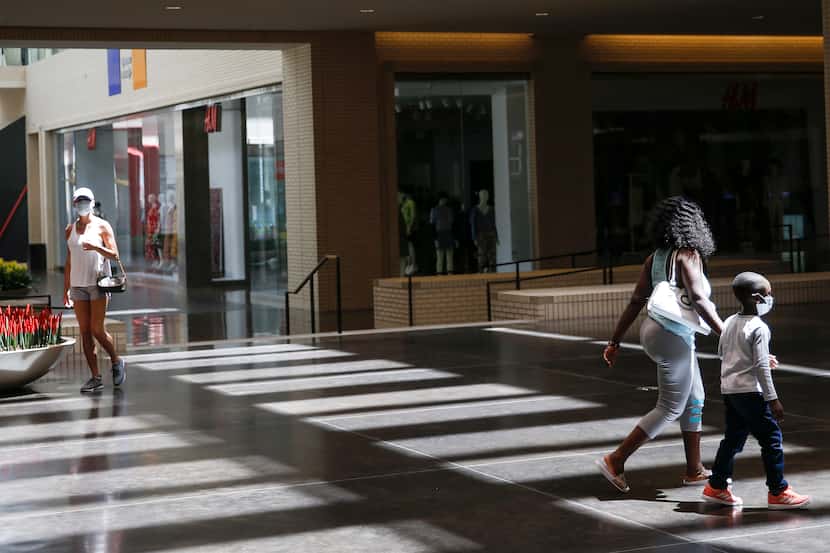 Shoppers walked through NorthPark Center mall on Friday in Dallas.