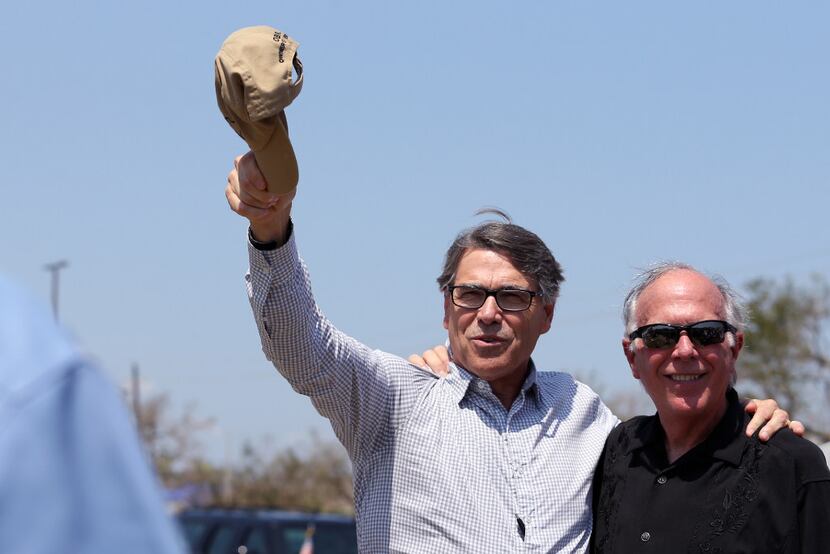 Secretary of Energy and former Texas governor Rick Perry (left) greets the crowd and State...