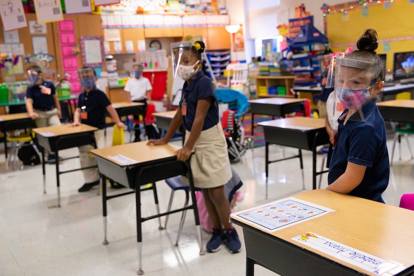 Students are distanced and wearing masks in Christine Ricci's classroom at Jerry R. Junkins...