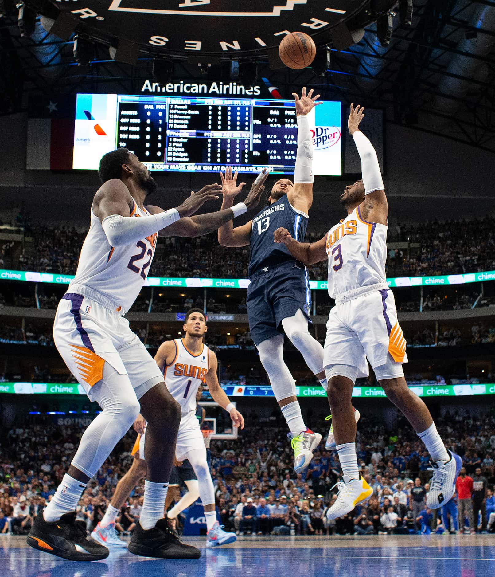 Dallas Mavericks guard Jalen Brunson (13) puts up a jumper in the lane over Phoenix Suns...