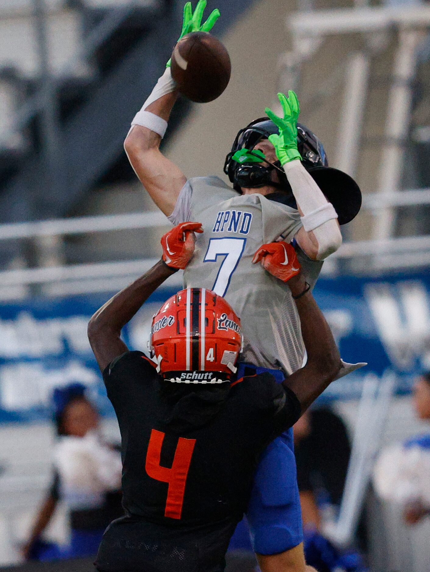 Hebron’s Tyler Hoke (7) catches a pass over Lancaster’s Victor Lincoln (4) in the first half...