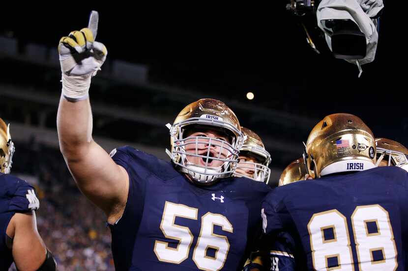 SOUTH BEND, IN - OCT. 17, 2015: Quenton Nelson (#56) of Notre Dame celebrates a 10-yard...
