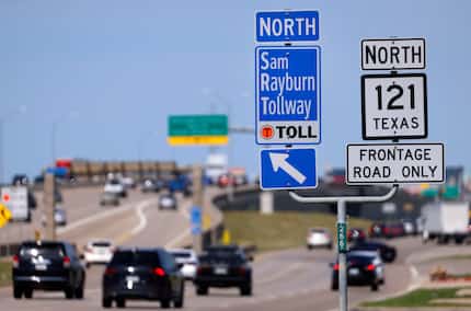 Signs for the Sam Rayburn Tollway direct drivers entering State Hwy 121 in Lewisville,...