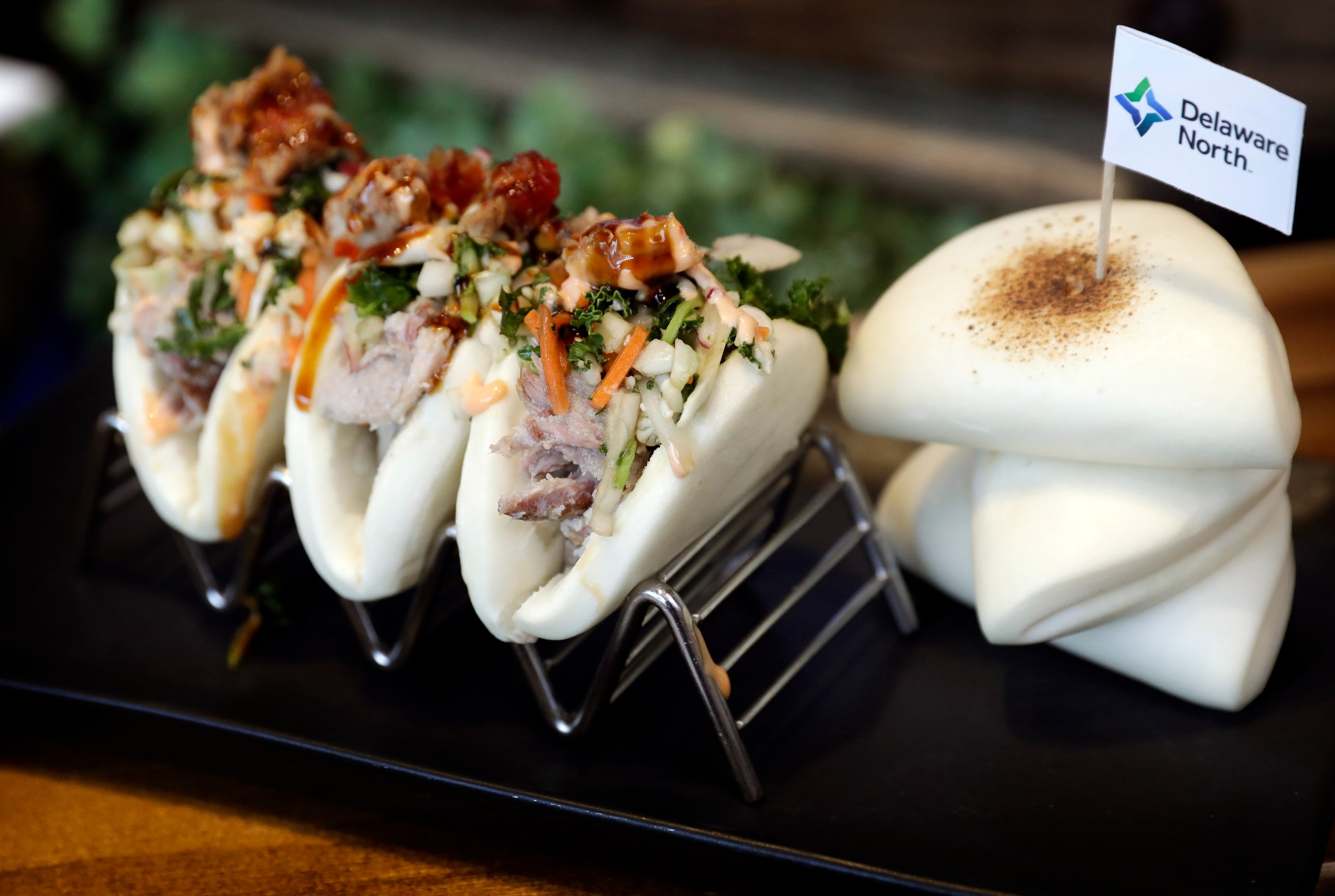 The Texas Rangers unveiled Korean Pork Steamed Buns, a menu item for the 2024 season at...