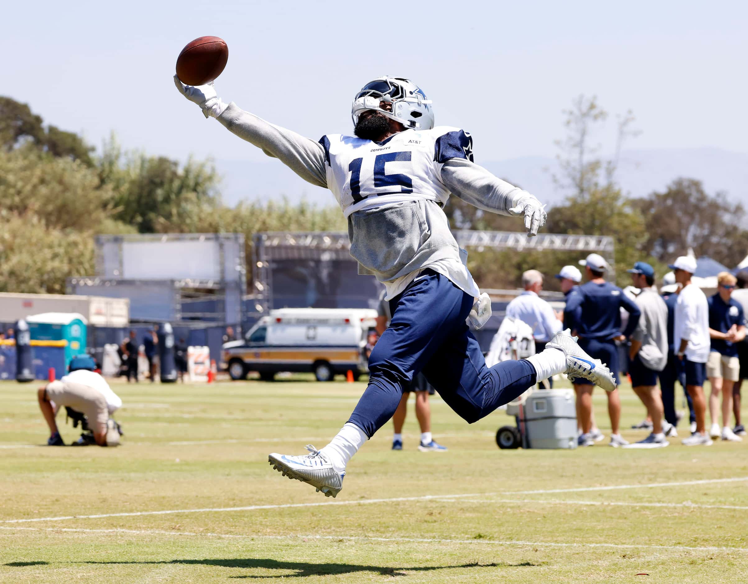 Dallas Cowboys running back Ezekiel Elliott (15) reaches for deep route pass in the end zone...