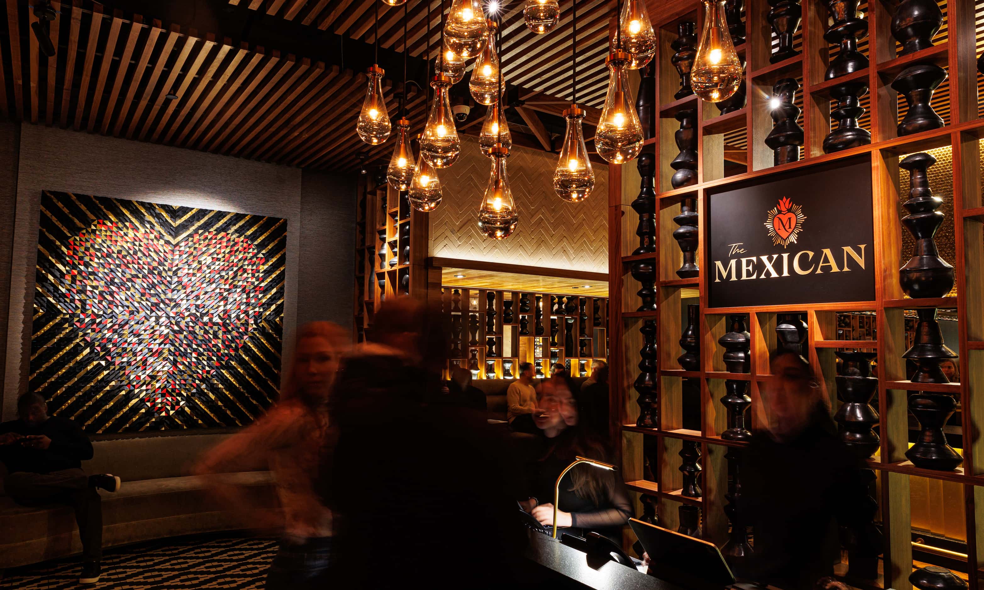 The entrance at The Mexican in Dallas shows a heart-themed piece of art that became part of...