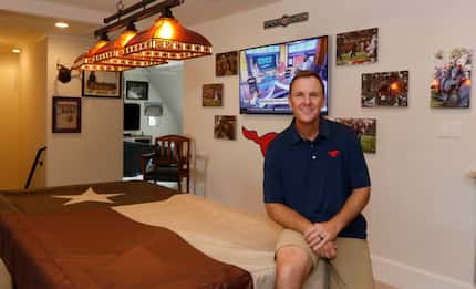 SMU head football coach Chad Morris poses for a portrait in his recruitment room in his home...