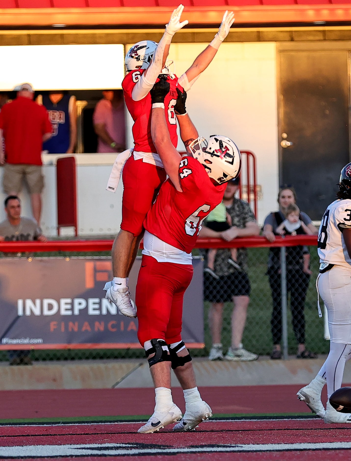 Argyle running back Watson Bell (6) celebrate with offensive lineman Weston Chaney (64)...